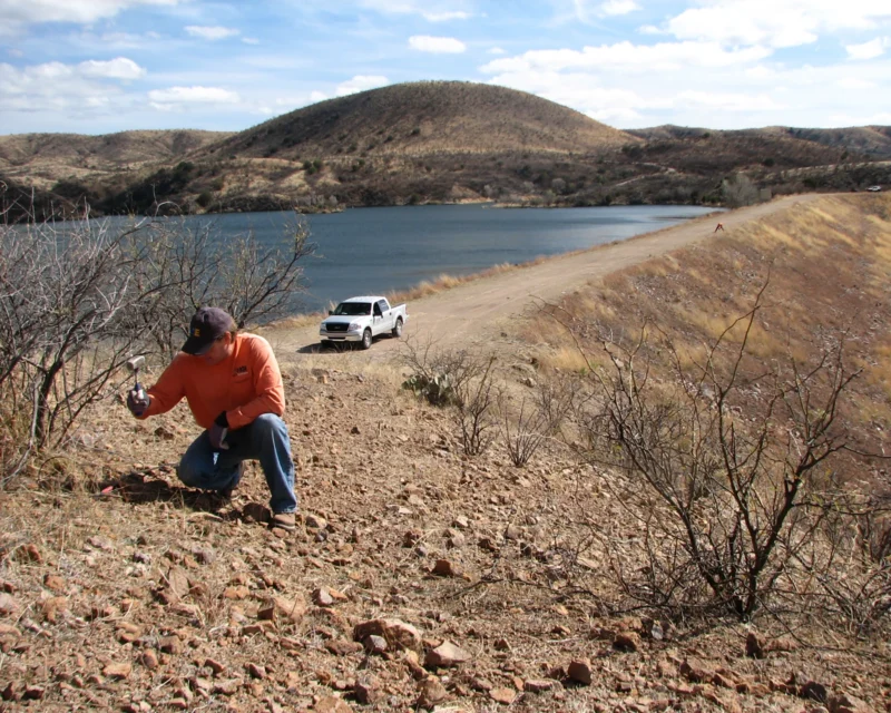 Technician conducts Dam characterization survey along embankment, collecting geophysical data to evaluate internal structure, material variability, and seepage conditions supporting dam assessment, monitoring, and infrastructure planning.