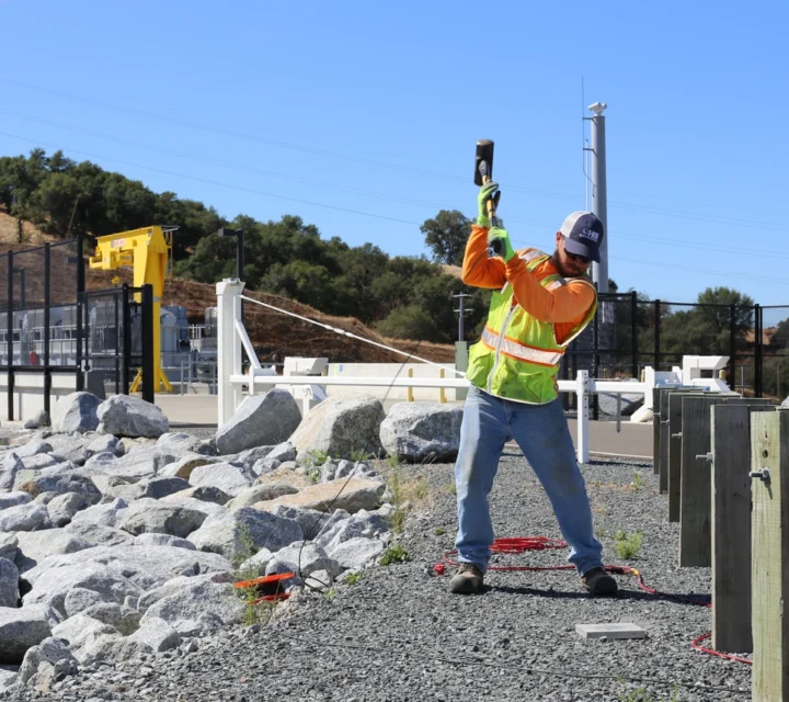 Technician installs geophysical sensor during Dam integrity assessment, collecting subsurface data to detect seepage pathways, internal erosion zones, and structural weaknesses affecting long-term dam stability and safety.