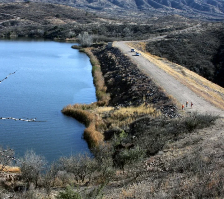 Aerial view of dam crest and reservoir during Dam seepage mapping, supporting identification of abnormal seepage zones, internal erosion pathways, and moisture anomalies affecting structural integrity and community safety.