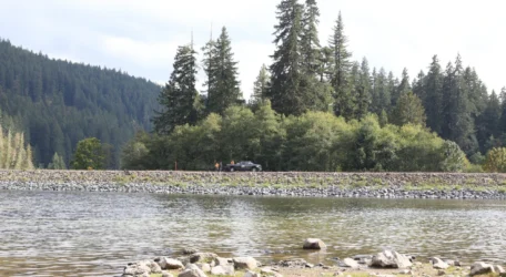 Groundwater monitoring survey conducted along a reservoir to assess subsurface conditions and aquifer behavior using geophysical methods.