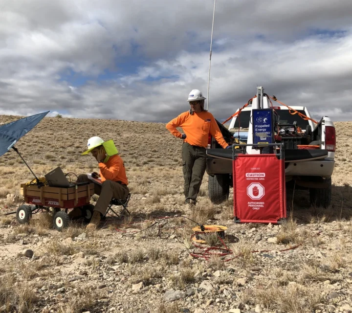 Field crew operating seismic equipment and recording surface waves during MASW surveys, using geophones and acquisition systems to measure shear-wave velocity, characterize near-surface stiffness, and map subsurface layering across survey area.