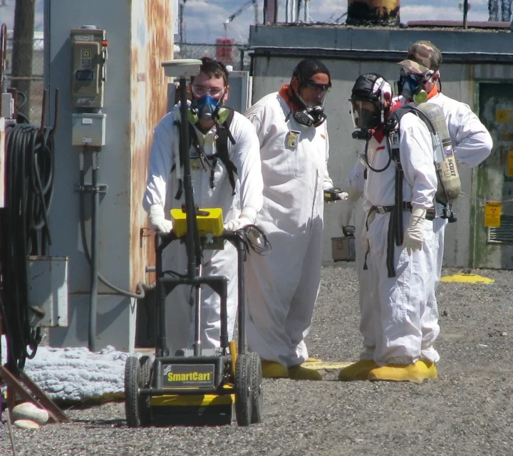 Technicians conducting pipeline leak detection with geophysical equipment to map subsurface leaks using electrical resistivity and related methods.