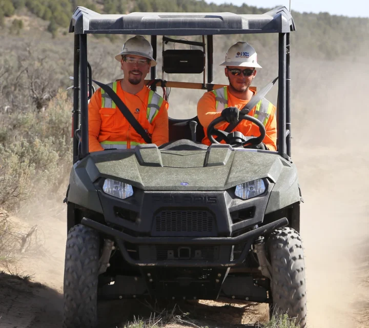 Plume mapping field crew mobilizing in utility vehicle to deploy geophysical equipment for subsurface contamination investigation, supporting groundwater protection, site characterization, and environmental remediation planning.